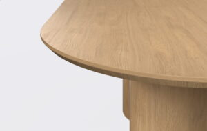 Owalny stół do jadalni o minimalistycznym designie.