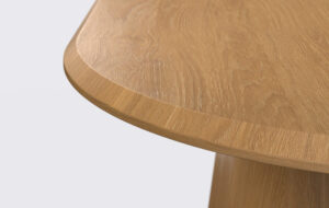 owalny stół do jadalni na nodze stożek, rozkładany, krawędź blatu ścięta od góry.