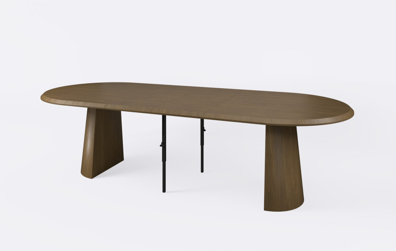 stół owalny na dwóch nogach w kształcie rozciętego stożka, rozłożony i poszerzony o dwa dodatkowe wkłady.