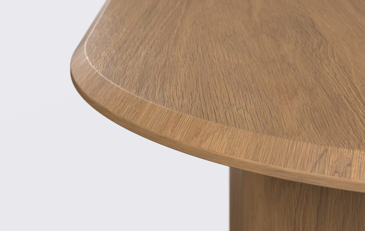 stół owalny rozkładany, krawędź blatu ścięta od góry.