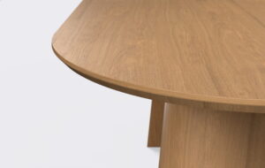 Stół fornirowany owalny na dwóch nogach, krawędź blatu podcięta od dołu, możliwość rozkładania stołu.