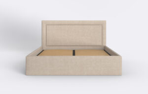 Beżowe łóżko tapicerowane z podnoszonym stelażem.