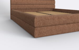 Łóżko tapicerowane z metalowym stelażem i pojemnikiem na pościel.