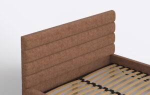 Łóżko tapicerowane z wysokim zagłówkiem.