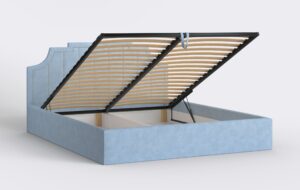 Niebieskie łóżko sypialniane z podnoszonym stelażem i pinezkami.