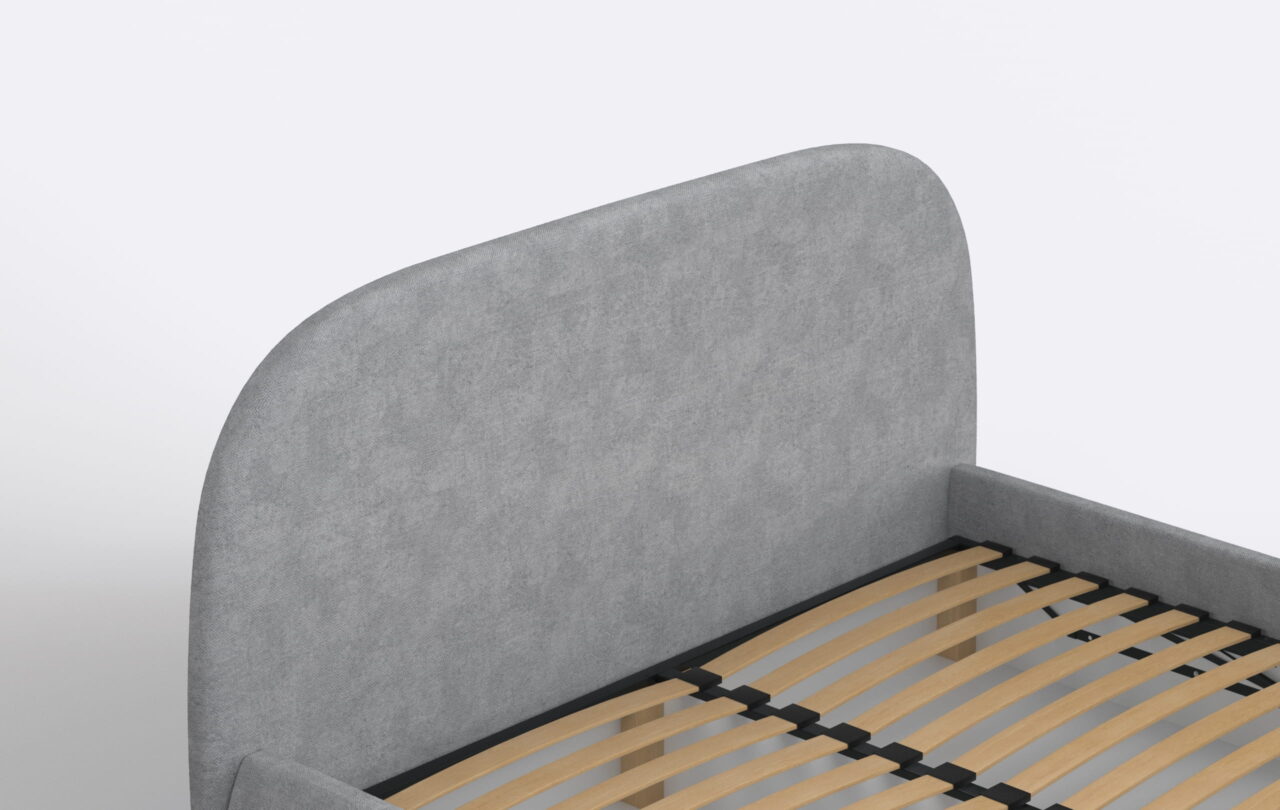 Nowoczesne łóżko tapicerowane z obłym zagłówkiem.