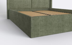 Tapicerowane łóżko w zielonym kolorze, do nowoczesnej sypialni.