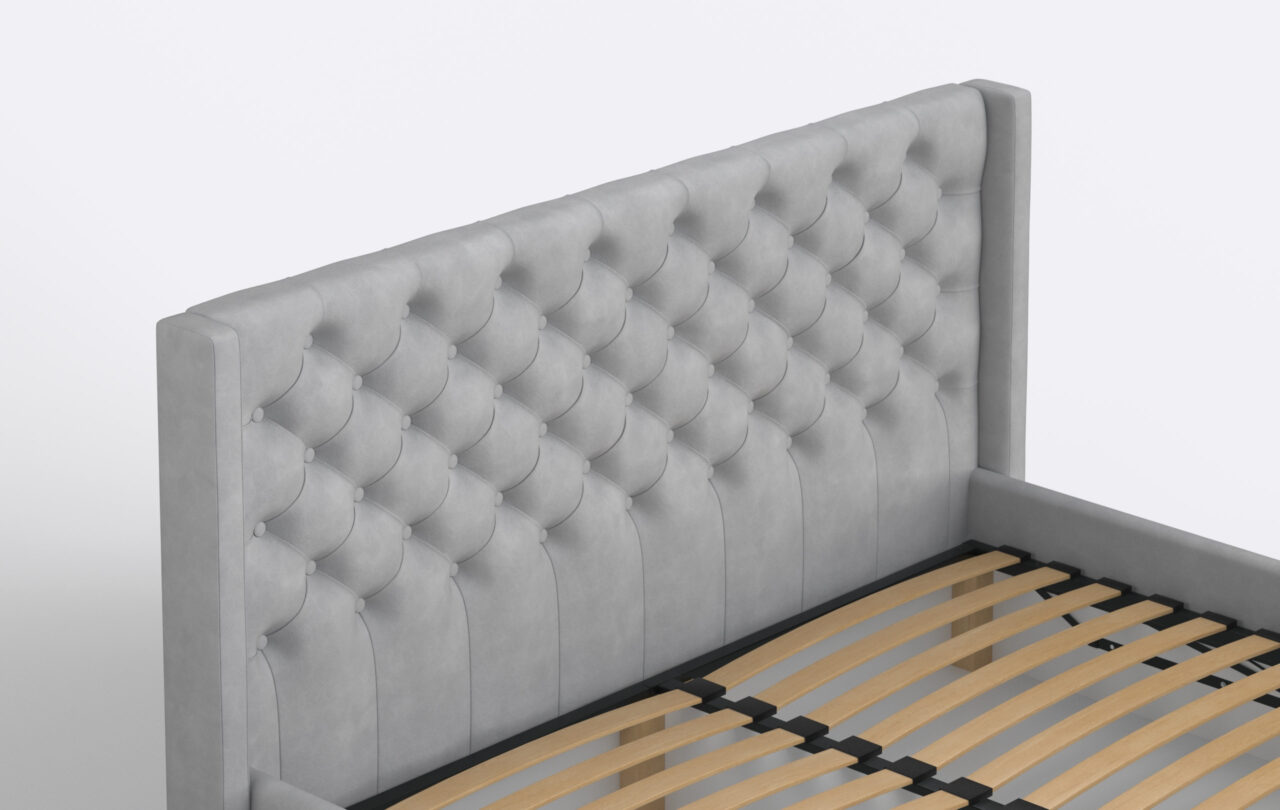 Szare łóżko do sypialni z pikowanym zagłówkiem.