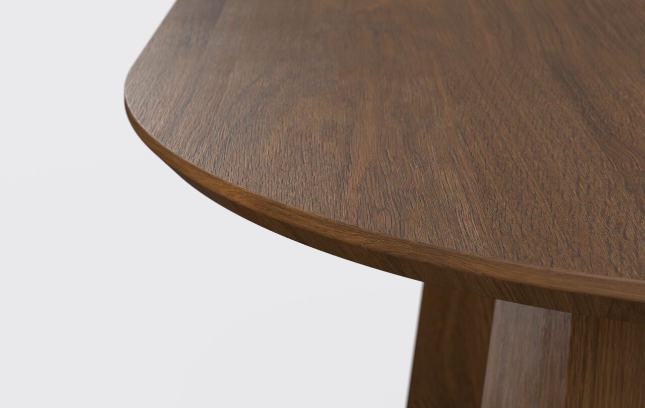 Owalny blat z podciętą krawędzią, grubość cztery centymetry, z płyty fornirowanej.