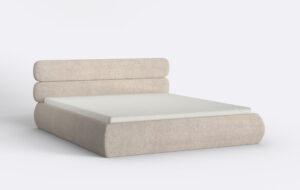 Obłe beżowe łóżko tapicerowane z materacem.