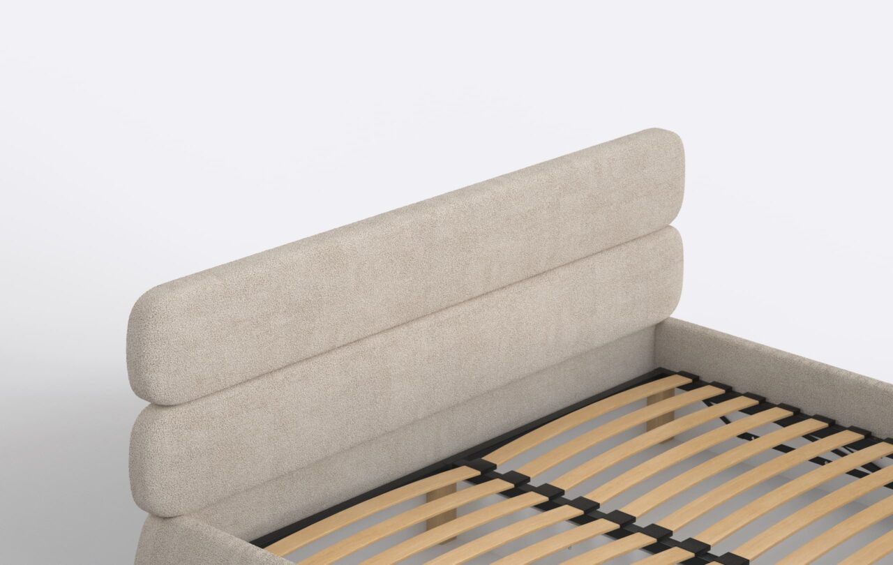 Łóżko tapicerowane z niskim zagłówkiem, zaokrąglone.