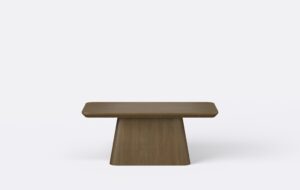 Stolik kawowy na stożkowej podstawie, krawędź blatu podcięta od dołu.