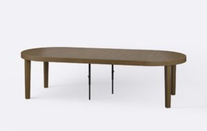 Rozłożony okrągły stół, poszerzony o cztery wkładki, minimalistyczny wygląd, w stylu skandynawskim.