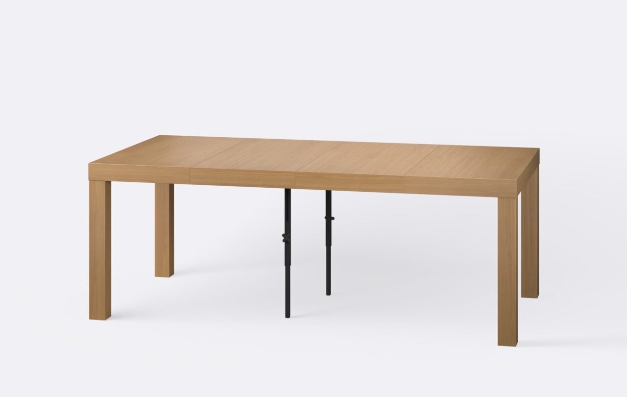 Drewniany minimalistyczny rozłożony stół, poszerzony o dwie wkładki, minimalistyczny styl.