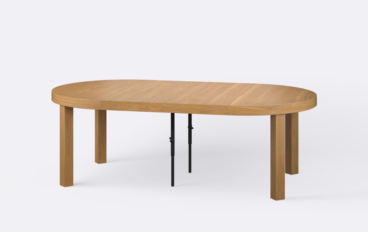 Rozłożony okrągły stół, poszerzony o dwie wkładki, dębowy, minimalistyczny, estetyczny.