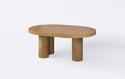 Rozłożony stół z grubym blatem na trzech nogach, wykonany z naturalnego forniru.